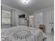 Cozy bedroom with neutral walls, patterned bedding, and a TV at 5457 Happy Hollow, Indianapolis, IN 46268