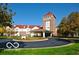 Beautiful exterior view of the community building, complete with lush landscaping and a grand entrance at 5457 Happy Hollow, Indianapolis, IN 46268