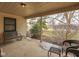 Spacious covered patio perfect for outdoor entertaining and relaxing with neighborhood views at 5457 Happy Hollow, Indianapolis, IN 46268