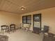 Inviting covered patio featuring comfortable seating, ideal for relaxing and enjoying the outdoors at 5457 Happy Hollow, Indianapolis, IN 46268