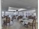 Bright dining area featuring multiple tables with leather chairs and hardwood floors for communal meals at 5457 Happy Hollow, Indianapolis, IN 46268