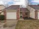 Charming single-story home with a red brick facade and attached single car garage at 5457 Happy Hollow, Indianapolis, IN 46268