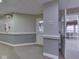 Hallway leading to the Main Street Lounge with neutral tones and access to community spaces at 5457 Happy Hollow, Indianapolis, IN 46268