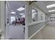 Hallway featuring a window to the Main Street Salon & Spa and access to other community areas at 5457 Happy Hollow, Indianapolis, IN 46268