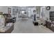Open-concept living area with dining space, neutral carpet and furnishings at 5457 Happy Hollow, Indianapolis, IN 46268