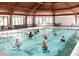 Indoor pool area designed with group fitness in mind, featuring an enclosed structure and ample seating at 5457 Happy Hollow, Indianapolis, IN 46268