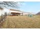 Expansive backyard with a covered patio and fire pit, ideal for outdoor entertaining and recreation at 5630 N Rockingham Ln, McCordsville, IN 46055
