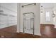 This bathroom features an ornate towel warmer, wood-look flooring, and storage at 5630 N Rockingham Ln, McCordsville, IN 46055