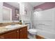 Bathroom with granite countertop, wood cabinets, and a shower-tub combination at 5630 N Rockingham Ln, McCordsville, IN 46055