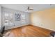 Bedroom featuring hardwood floors, a ceiling fan, and windows with natural light at 5630 N Rockingham Ln, McCordsville, IN 46055