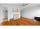Spacious bedroom with wooden floors, white walls, and a ceiling fan at 5630 N Rockingham Ln, McCordsville, IN 46055