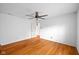 Bedroom featuring hardwood floors, a ceiling fan, and a view to the hallway at 5630 N Rockingham Ln, McCordsville, IN 46055