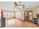 Dining area featuring wood floors, plantation shutters, and a glass patio door at 5630 N Rockingham Ln, McCordsville, IN 46055