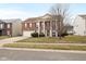 Beautiful brick two-story home with attached garage and landscaped front yard at 5630 N Rockingham Ln, McCordsville, IN 46055
