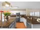 Well-lit kitchen with granite countertops, an island and stainless steel appliances at 5630 N Rockingham Ln, McCordsville, IN 46055