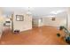 Spacious living room with hardwood floors, large windows and adjacent kitchen at 5630 N Rockingham Ln, McCordsville, IN 46055