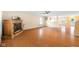 Spacious living room with wood flooring, brick fireplace, and natural light from windows at 5630 N Rockingham Ln, McCordsville, IN 46055