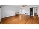Living room features hardwood floors, a dark barn door, and plantation shutters at 5630 N Rockingham Ln, McCordsville, IN 46055