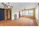 Bright and spacious living room with wood flooring, shutters, and a decorative sliding barn door at 5630 N Rockingham Ln, McCordsville, IN 46055