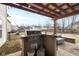 Outdoor kitchen with built in grill and bar area featuring a pergola in backyard at 5630 N Rockingham Ln, McCordsville, IN 46055