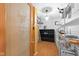 Walk-in pantry featuring wire shelving, cabinet organizers, and a frosted glass door at 5630 N Rockingham Ln, McCordsville, IN 46055