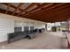Comfortable outdoor seating area on a covered patio, great for relaxing and entertaining at 5630 N Rockingham Ln, McCordsville, IN 46055