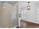 Bathroom featuring a glass enclosed shower, plantation shutters and decorative lantern at 5630 N Rockingham Ln, McCordsville, IN 46055