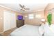 Cozy bedroom with a ceiling fan, television, and closet at 5924 Elaine St, Indianapolis, IN 46224