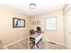 Office/Bedroom with light carpet, small desk, and natural light from a large window at 5924 Elaine St, Indianapolis, IN 46224