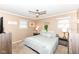 Neutral bedroom with ceiling fan, carpet, and two windows for ample natural light at 5924 Elaine St, Indianapolis, IN 46224