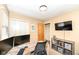 Bedroom featuring a desk, wall-mounted television, and storage cabinets for optimal organization at 5924 Elaine St, Indianapolis, IN 46224