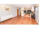 Open-concept living room flows into the kitchen featuring wood floors and natural light at 5924 Elaine St, Indianapolis, IN 46224