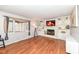 Cozy living room featuring a fireplace with a mantel and built-in bookshelves at 5924 Elaine St, Indianapolis, IN 46224