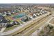 An aerial shot showing the home's location on a quiet street and nearby pond at 5955 Stroup Dr, Noblesville, IN 46062