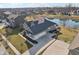 Back aerial view shows the home's three-car garage, landscaped yard, and proximity to the neighborhood at 5955 Stroup Dr, Noblesville, IN 46062