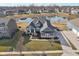 An elevated view of the property reveals the home's attractive curb appeal and serene pond-side setting at 5955 Stroup Dr, Noblesville, IN 46062