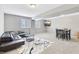 Cozy basement living area with a TV, a leather sectional, and dining table at 5955 Stroup Dr, Noblesville, IN 46062