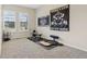 Home gym featuring ample natural light, exercise equipment, and motivational wall art at 5955 Stroup Dr, Noblesville, IN 46062