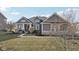 Charming single-story home featuring stone accents, a covered porch, and a well-manicured front yard at 5955 Stroup Dr, Noblesville, IN 46062