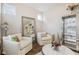 Cozy living room with plush seating, stylish decor, and natural light offers a comfortable retreat at 5955 Stroup Dr, Noblesville, IN 46062
