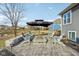 Outdoor patio area featuring a cozy fire pit surrounded by comfortable seating and a serene backyard view at 5955 Stroup Dr, Noblesville, IN 46062