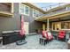 Backyard patio featuring outdoor seating, hot tub and pergola with string lights at 6640 E Deerfield Dr, Zionsville, IN 46077