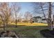 Expansive backyard featuring a well-maintained lawn and a stylish two-story home, blending comfort and nature at 6640 E Deerfield Dr, Zionsville, IN 46077