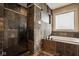 Bathroom features black slate tile shower with pebble floor and a soaking tub with tiled surround at 6640 E Deerfield Dr, Zionsville, IN 46077