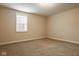 Clean bedroom with window and neutral tones at 6640 E Deerfield Dr, Zionsville, IN 46077