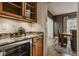 Charming butler's pantry features a wine cooler and convenient bar area at 6640 E Deerfield Dr, Zionsville, IN 46077
