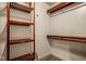 Walk-in closet with built-in wood shelves and rack system for organization at 6640 E Deerfield Dr, Zionsville, IN 46077