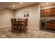 Basement dinette area with table, six chairs, and convenient bar area at 6640 E Deerfield Dr, Zionsville, IN 46077