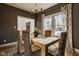 Spacious dining room perfect for entertaining, featuring large windows and a stylish table setting at 6640 E Deerfield Dr, Zionsville, IN 46077