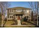 Inviting two-story home featuring a charming front porch and well-maintained landscaping at 6640 E Deerfield Dr, Zionsville, IN 46077